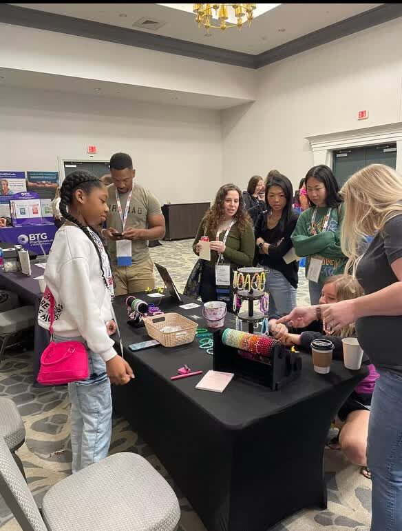 Pharmacists gathered at Maddison's bracelet booth at EmpowerX