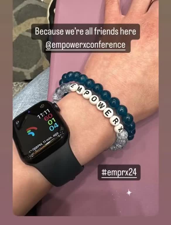 An EmpowerX beaded bracelet worn on a customer's wrist